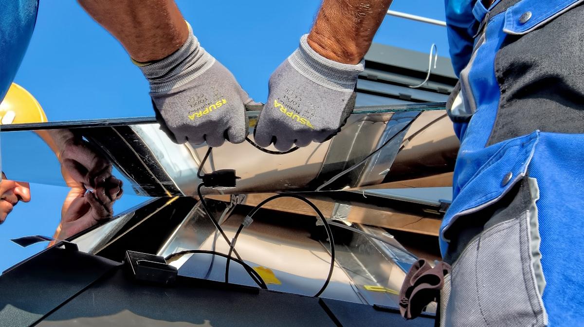 Workers installing solar panels